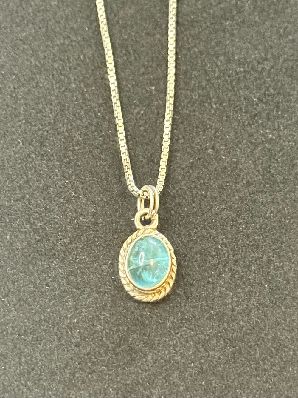 Sterling Silver Oval, Iridescent Blue-Green Gem Pendant w/ Twisted Bezel Accent